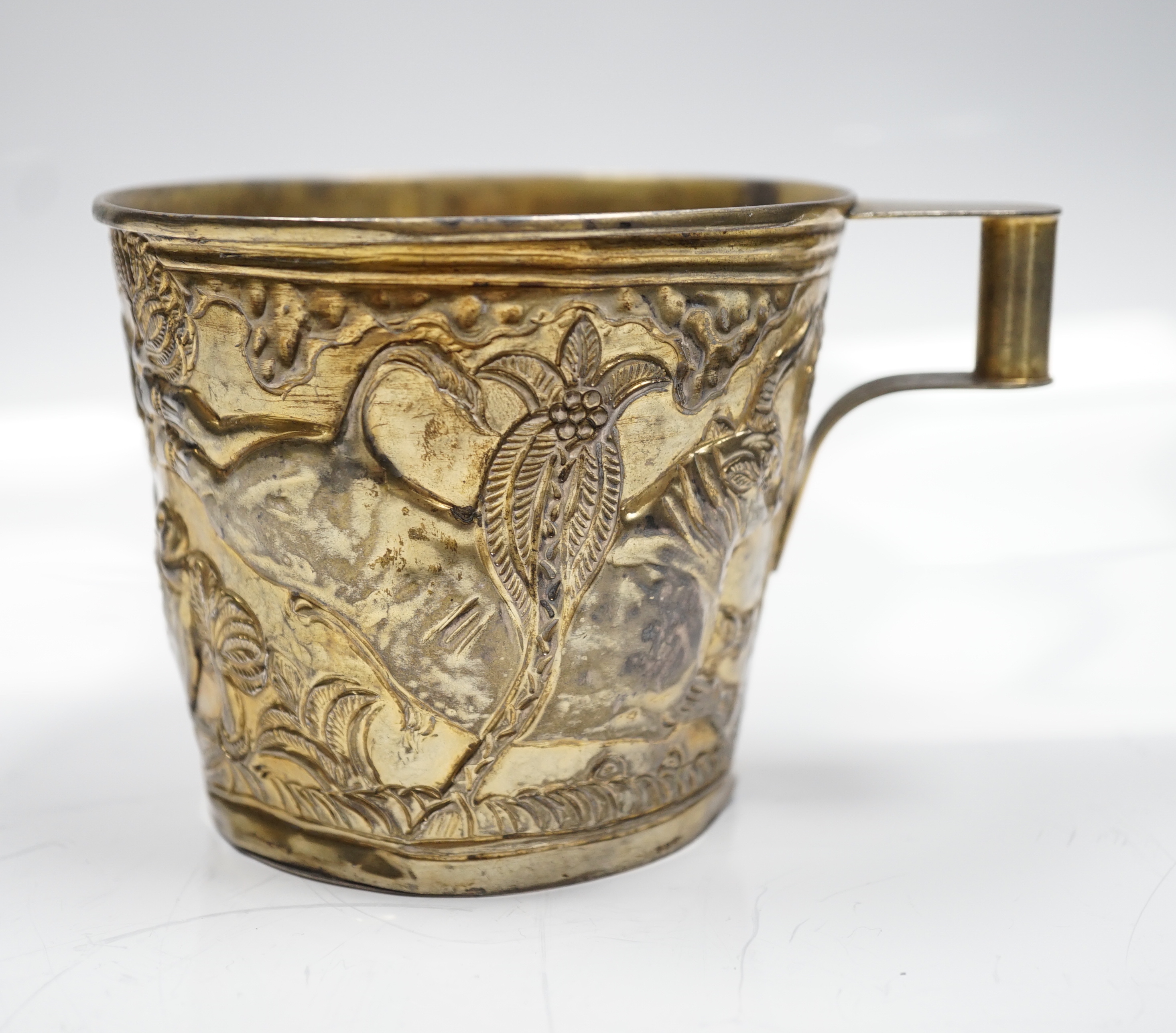 A Greek Lalaounis 900 standard gilt white metal, cup, embossed with continuous raging bull scene, height 90mm, 6.5oz.